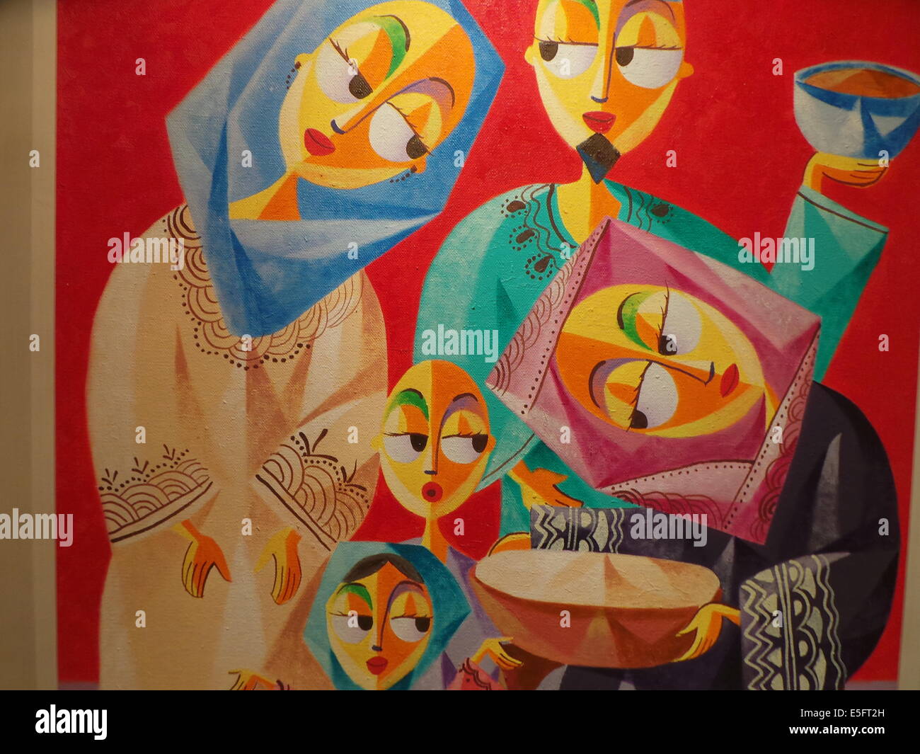 A painting of Jovan Benito entitled 'Southern Flavors' is showcased during the Eid'l Fitr Festival in Newport Mall in Pasay City, in a gallery entitled 'Unite as Muslim and Christian artist as one', which highlights paintings of Muslims and Christians upholding family values and traditions in the Philippines. © Sherbien Dacalanio/Pacific Press/Alamy Live News Stock Photo