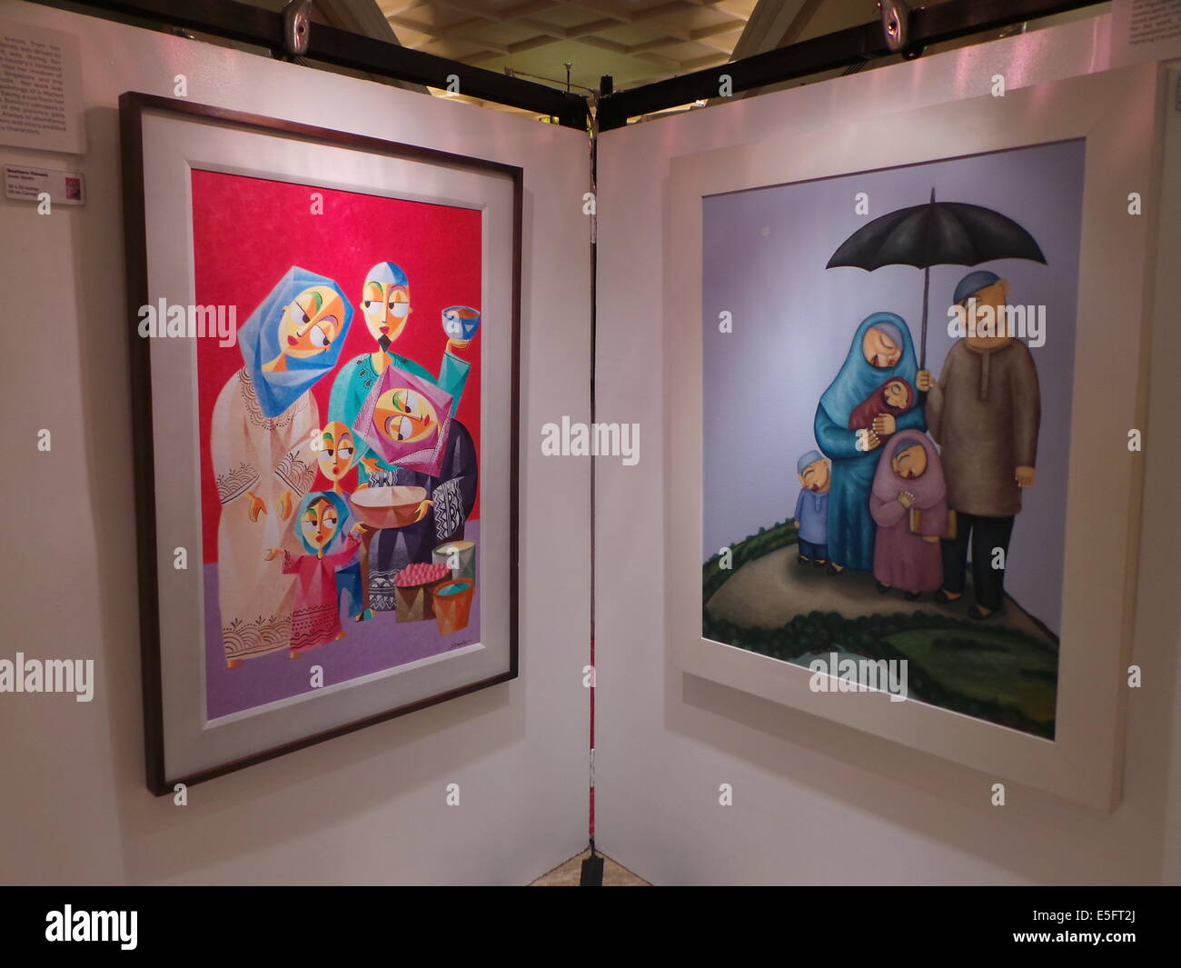 During the Eid'l Fitr Festival in Newport Mall in Pasay City, gallery entitled 'Unite as Muslim and Christian artist as one' showcases paintings of Muslims and Christians upholding family values and traditions of both Christian and Muslim culture in the Philippines. © Sherbien Dacalanio/Pacific Press/Alamy Live News Stock Photo