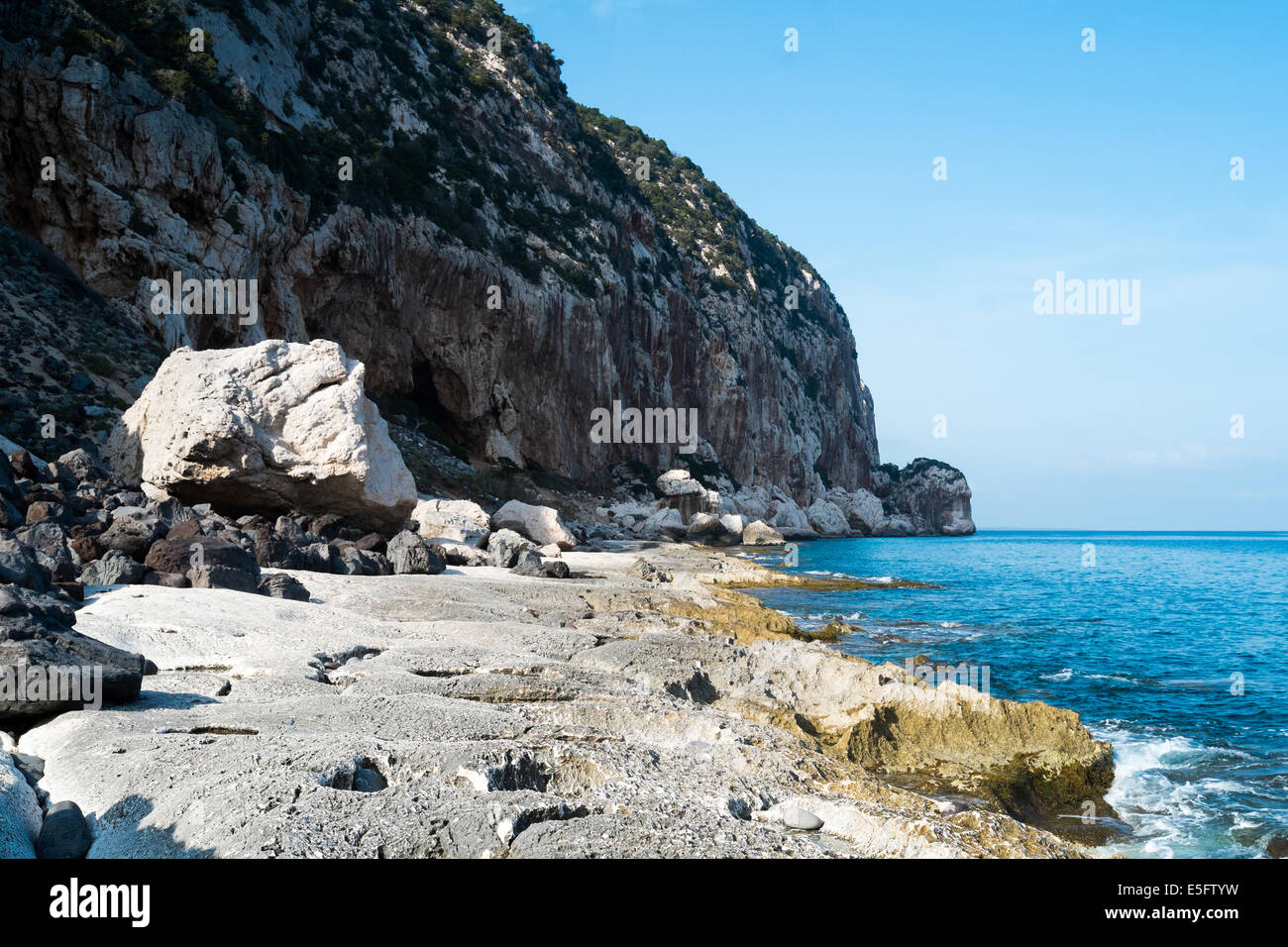 Volcanin coast close to Biddiriscottai cave in Cala Gonone, Sardinia, Italy Stock Photo
