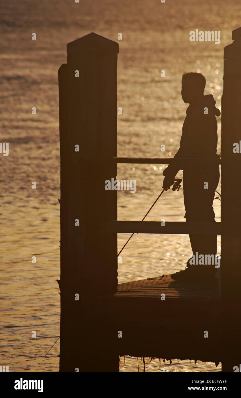 Silhouette of man fishing hi-res stock photography and images - Alamy