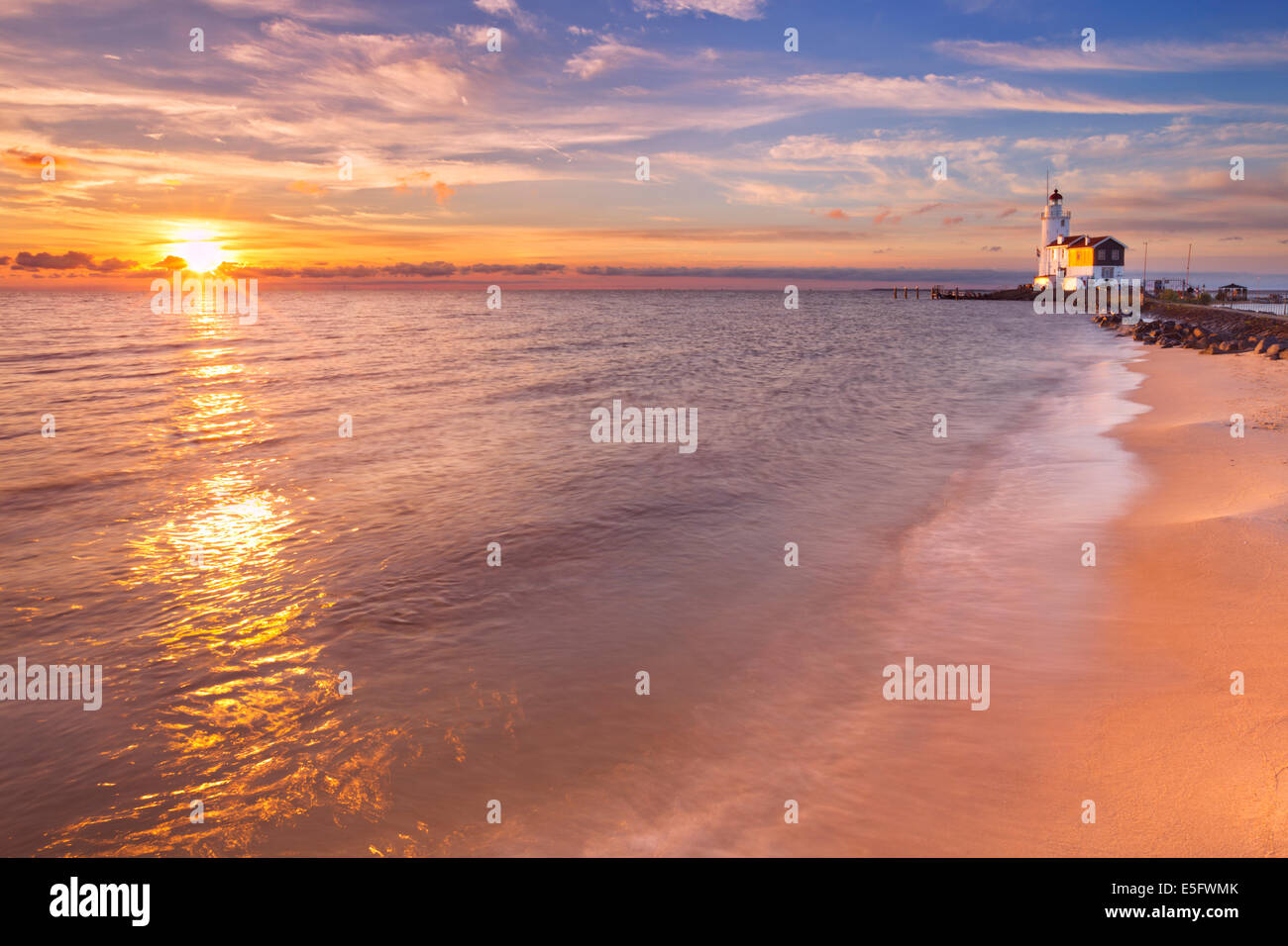 The lighthouse of the island of Marken, The Netherlands. Photographed at sunrise. Stock Photo