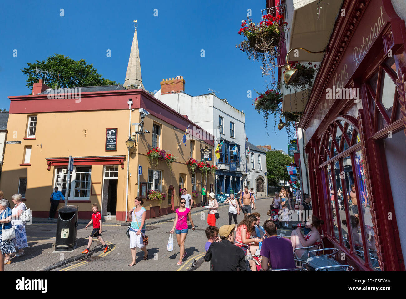 Tenby harbour town in Pembrokeshire with tourists walking around Stock Photo