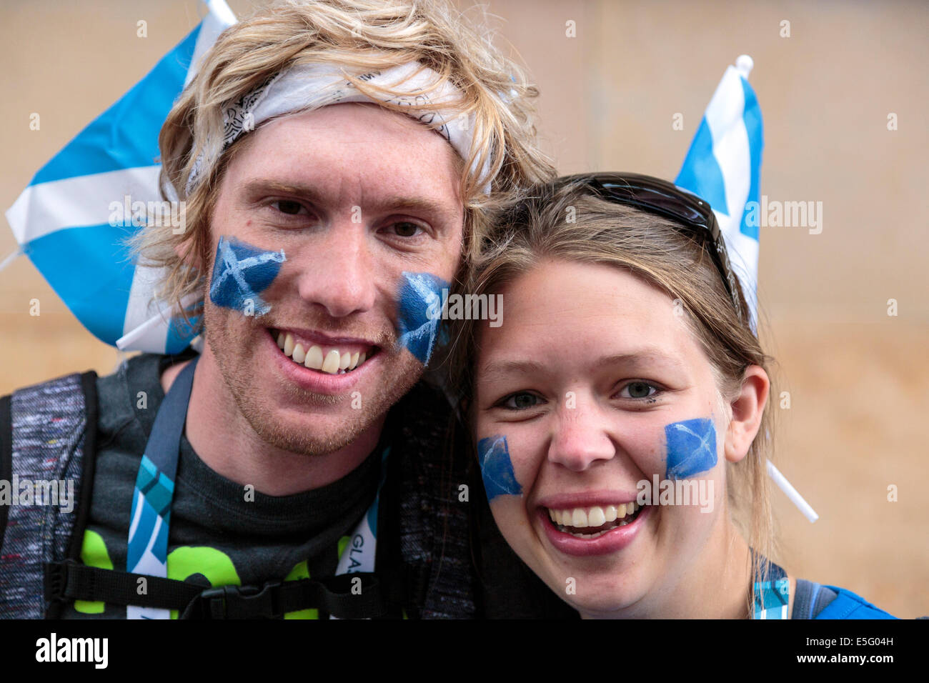Craig Polson, aged 33, and Anna Carr-Gomm, aged 25 in Glasgow supporting Scotland Stock Photo