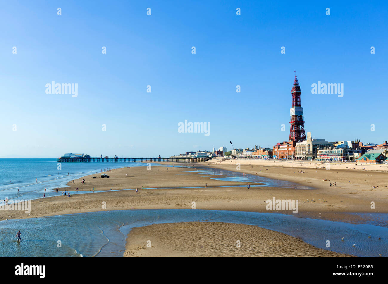 Beach in the late afternoon looking towards North Pier and Blackpool Tower, The Golden Mile, Blackpool, Lancashire, UK Stock Photo
