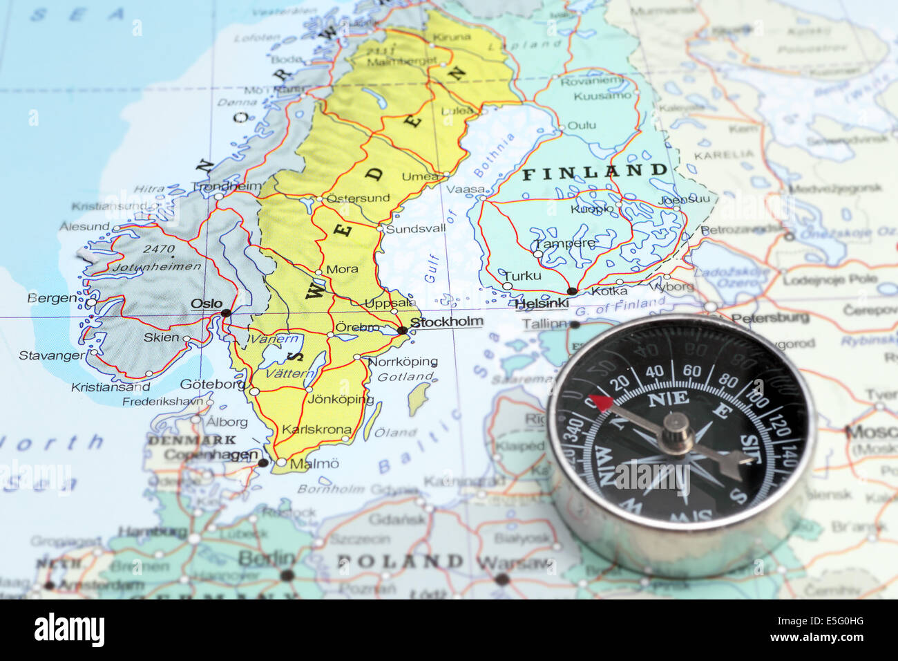 Compass on a map pointing at Norway Sveden and Finland, planning a travel destination in Scandinavia Stock Photo