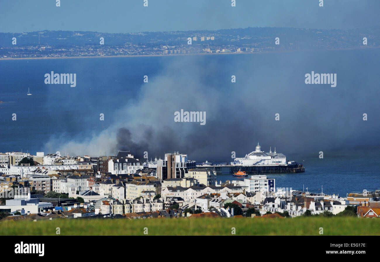 Eastbourne, Sussex, UK. 30th July, 2014. Plumes of smoke rise above Eastbourne Pier fire after it  caught alight this afternoon Stock Photo