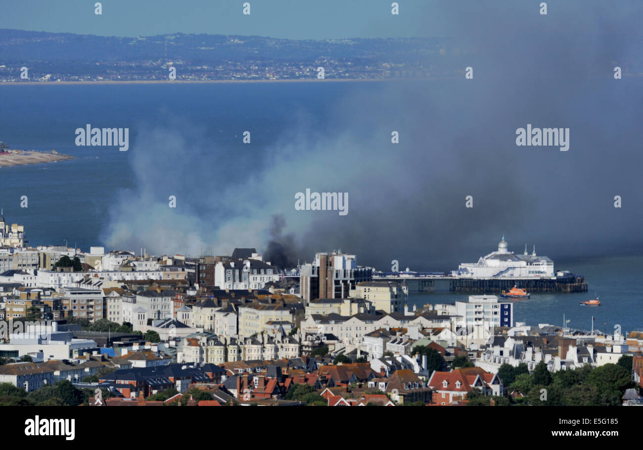 Eastbourne, Sussex, UK. 30th July, 2014. Plumes of smoke rise above Eastbourne Pier fire after it  caught alight this afternoon Stock Photo