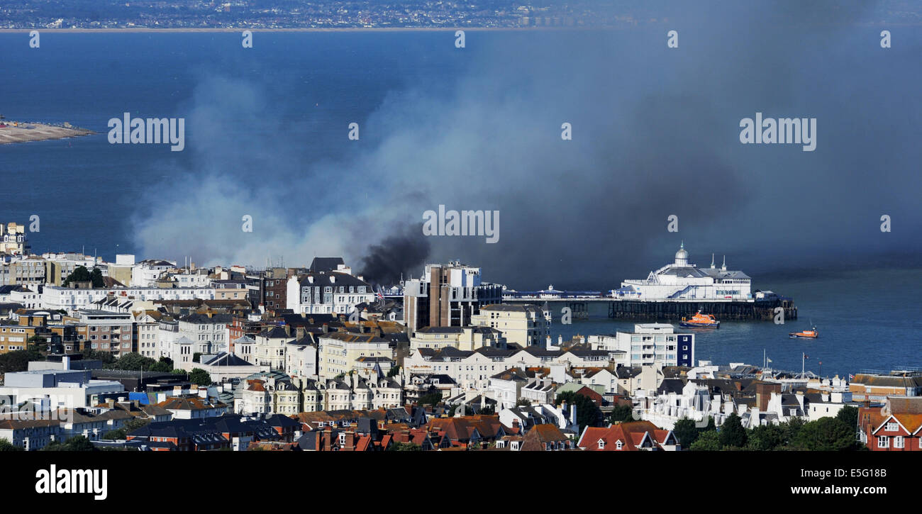 Eastbourne, Sussex, UK. 30th July, 2014. Plumes of smoke rise above Eastbourne Pier fire after it  caught alight this afternoon Stock Photo