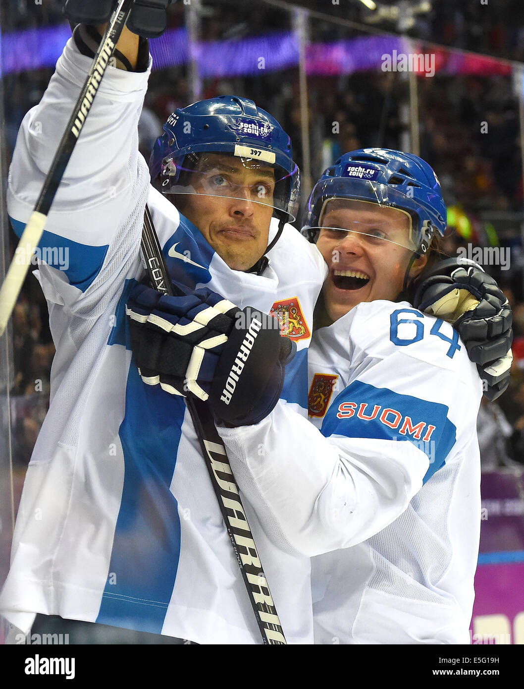 Finland forward Teemu Selanne (8), left, and forward Mikael Granlund (64) celebrate Selanne's goal against USA goalie Jonathan Quick (32) during the second period of the men's Bronze Medal hockey game at the Winter Olympics in Sochi, Russia, Saturday, February 22, 2014. Finland defeated USA 5-0 to capture the Bronze Medal.  (Harry E. Walker/MCT) Stock Photo