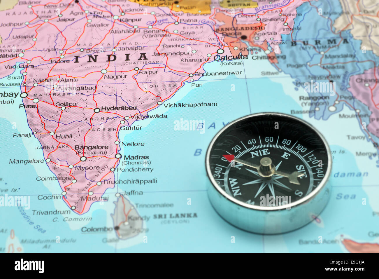 Compass on a map pointing at India and planning a travel destination Stock Photo