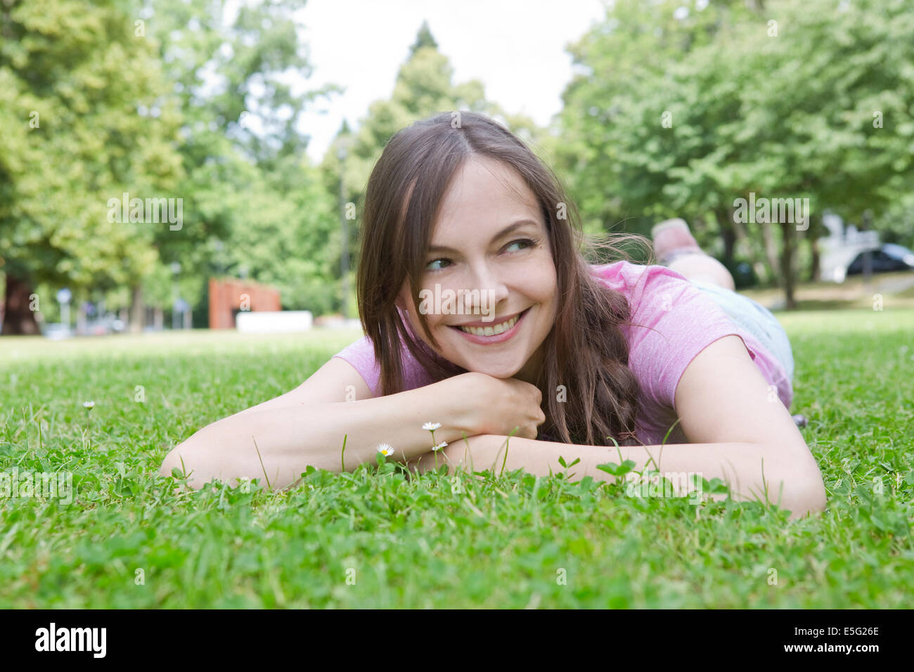 Woman lying on a meadow Stock Photo
