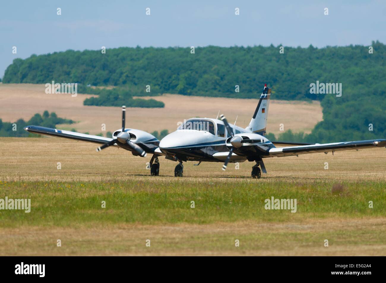 Twin engines plane Piper Pa34 200T Seneca II landed on grass airfield