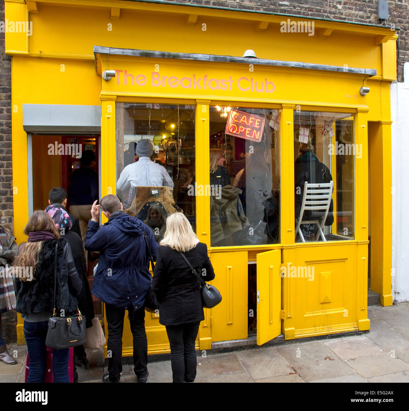 Queue of people outside The Breakfast Club, Camden Passage, Islington London England UK Stock Photo