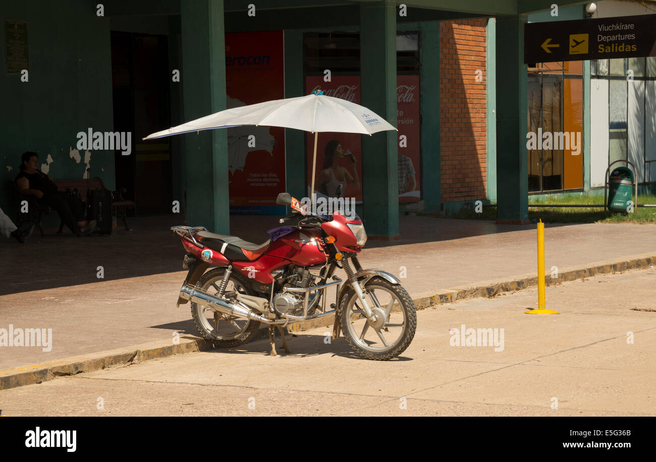 Motorbike taxi with aerodynamic sunshade umbrella Stock Photo