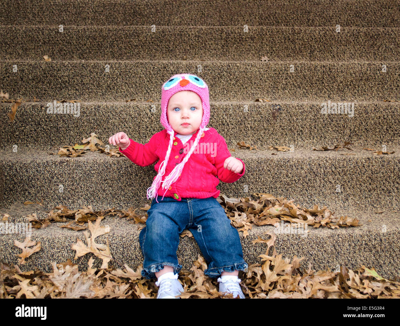 Portrait of baby boy on steps (6-11 months) Stock Photo