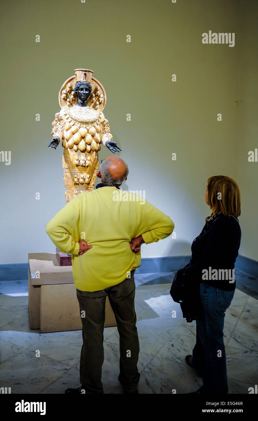 Naples, Italy, Tourists observing a Marble statue at a museum Stock Photo