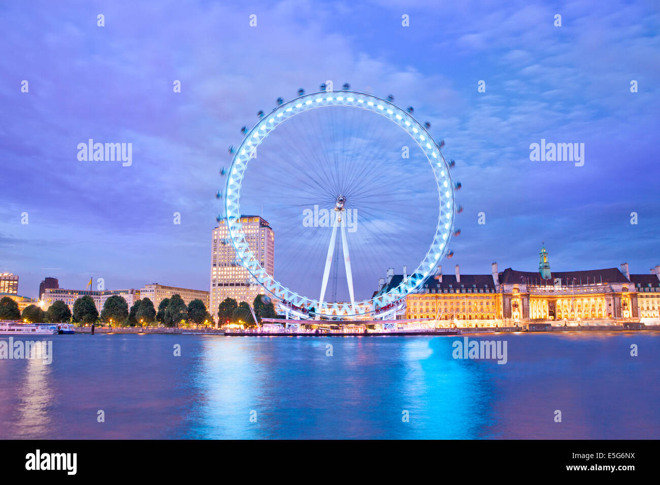 UK, London Eye, County Hall with the London Aquarium and the Shell Building at night Stock Photo