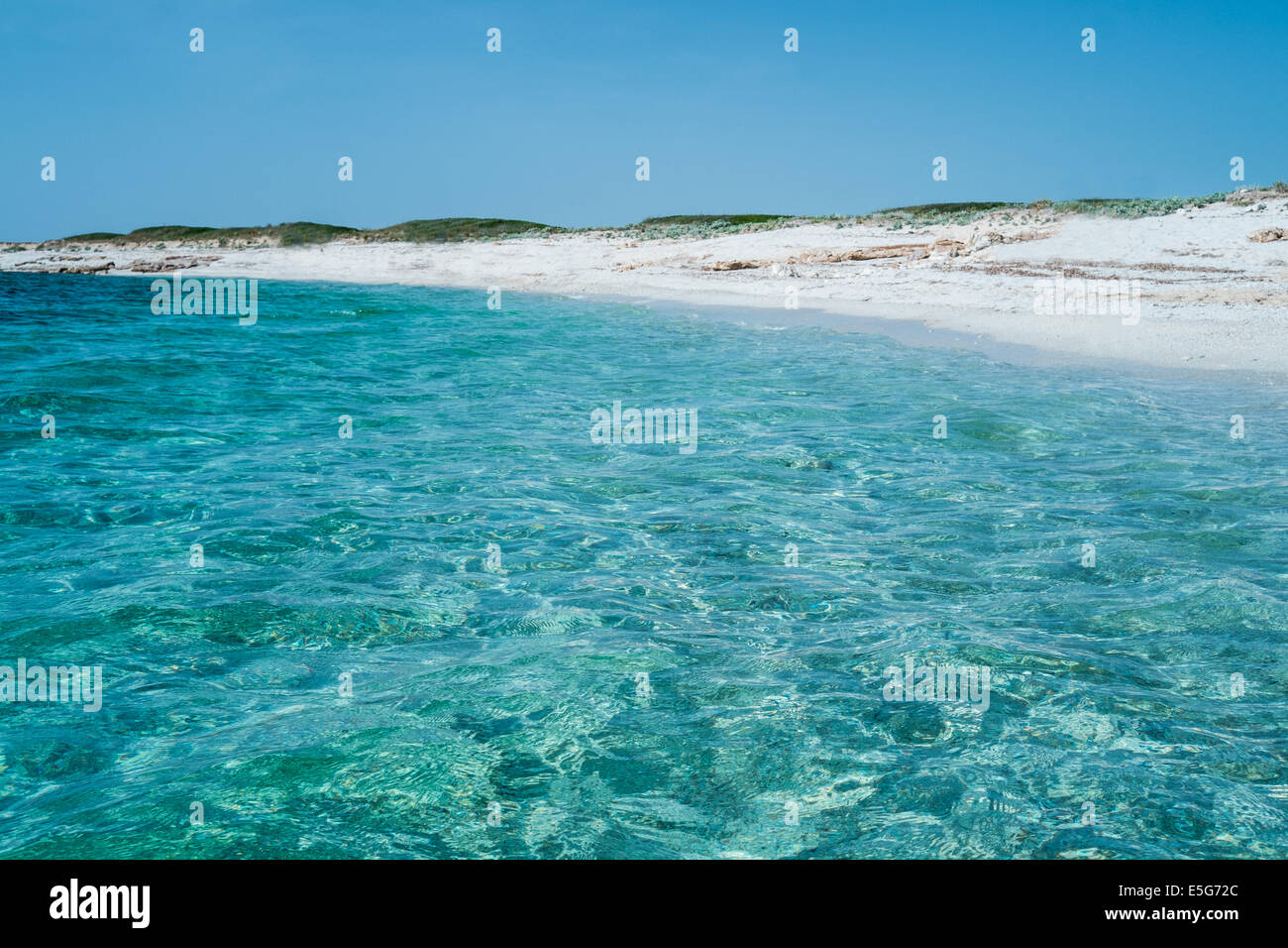 Transparent blue water in Is Aruttas beach, Oristano, Sardinia, Italy Stock Photo
