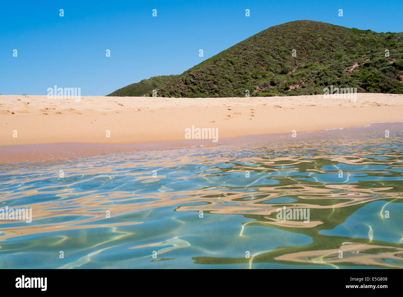 Sea and beach along green coast, west Sardinia, Italy Stock Photo