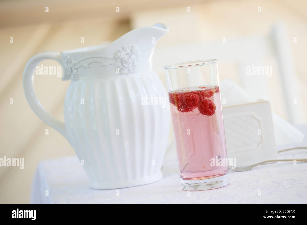 Cooling raspberry beverage in summer Stock Photo - Alamy