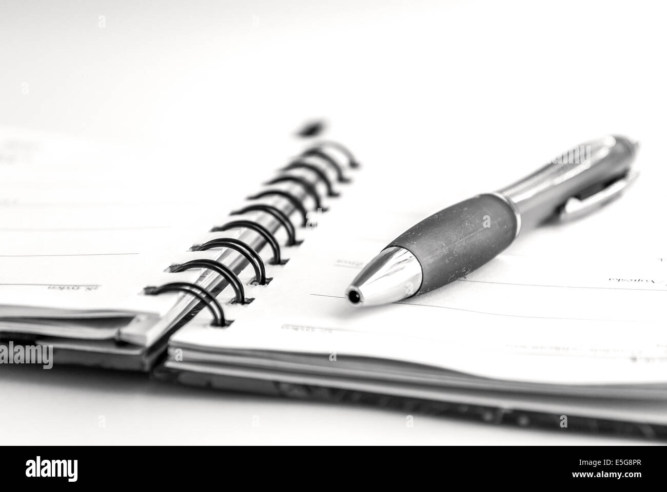 pen and notepad on white background Stock Photo - Alamy