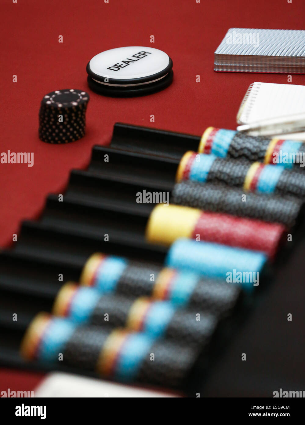 Dealer chip in poker game Stock Photo
