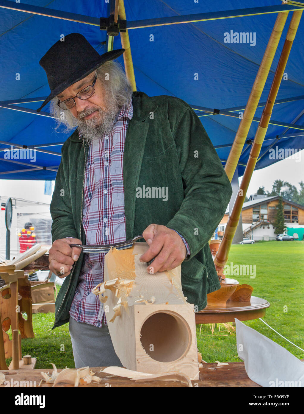 Carving the 'horn' of an alphorn from a solid block of wood Stock Photo