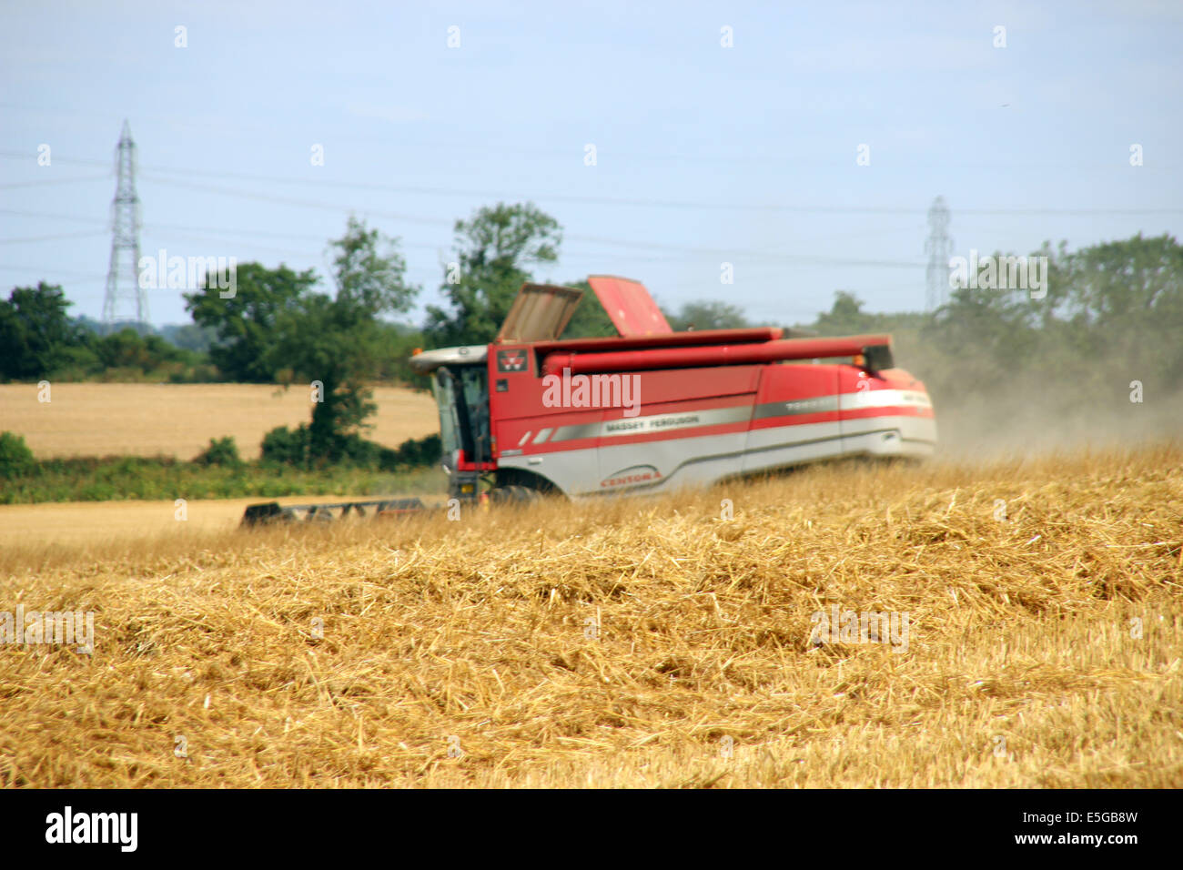 Nuneham Courtenay, Oxfordshire, UK. 30th July, 2014. Wheat harvest at Nuneham Courtenay. Credit: shane leach/ Alamy Live News Stock Photo