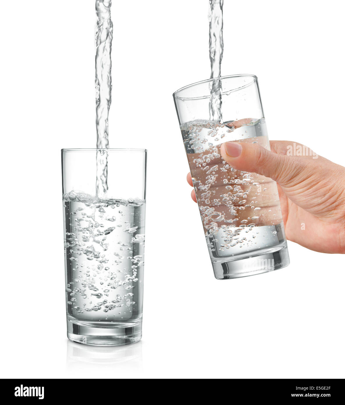 filling water into glass, with and without hand holding it Stock Photo
