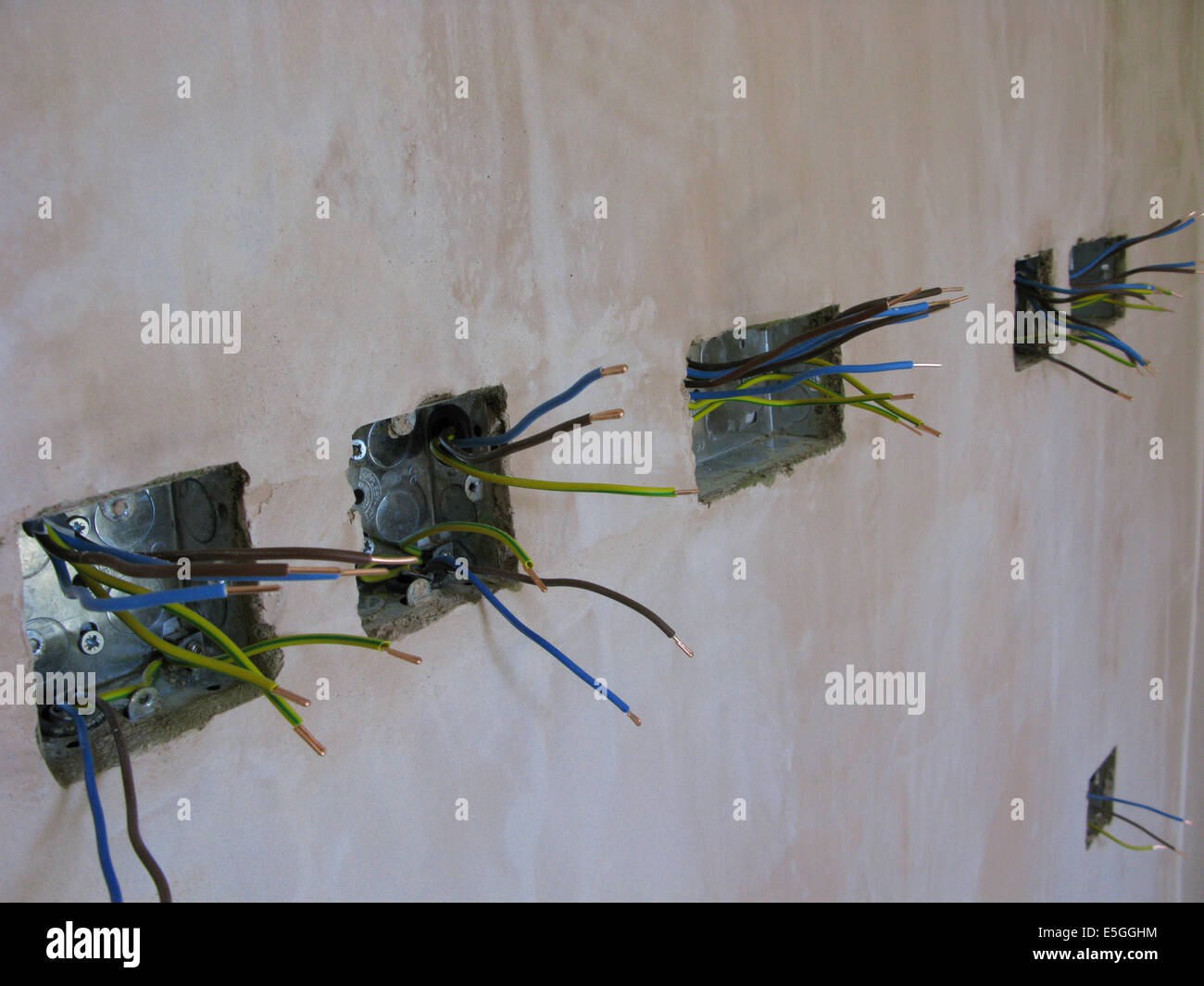 Electric sockets with wires ready for wiring into a new property or