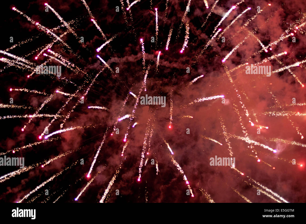 Red fireworks against night background Stock Photo Alamy