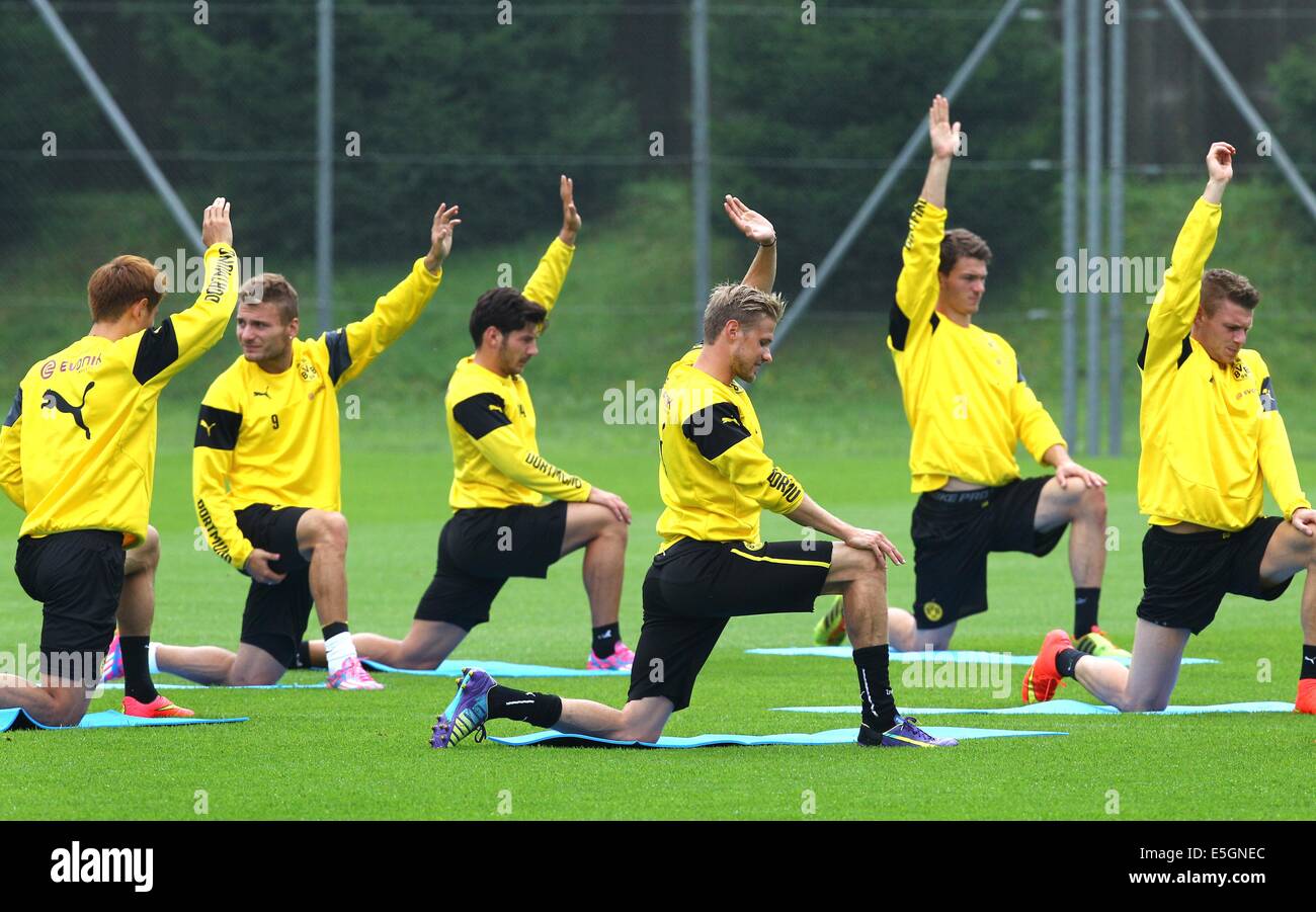 Bad Ragaz, Switzerland. 31st July, 2014. Dong-Won Ji (L-R), Ciro Immobile, Milos Jojic, Oliver Kirch, Christoph Zimmermann and Lukasz Piszczek of Borussia Dortmund go through their warm-up routine during a training session at the team's training camp in Bad Ragaz, Switzerland, 31 July 2014. The German soccer Bundesliga prepares for the up-coming season 2014/15 until 06 August. Photo: KARL-JOSEF HILDENBRAND/dpa/Alamy Live News Stock Photo