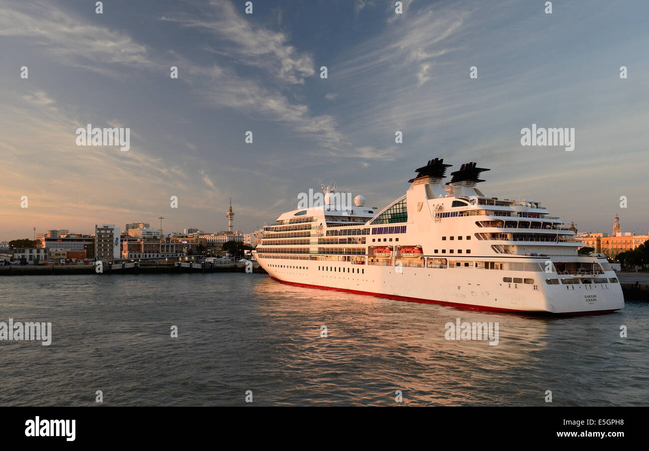 Luxury cruise ship MS Seabourn Sojourn highlighted by early morning sunshine. Stock Photo