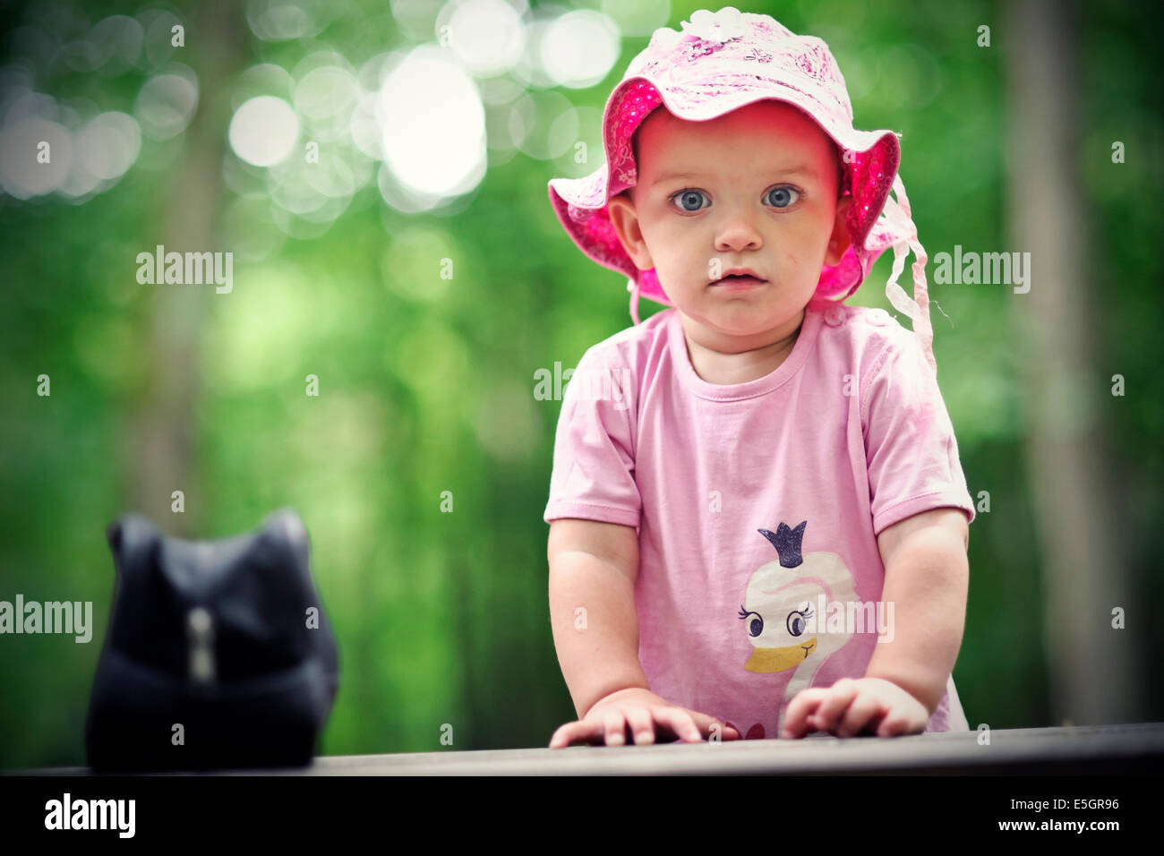 Small girl in the forest Stock Photo