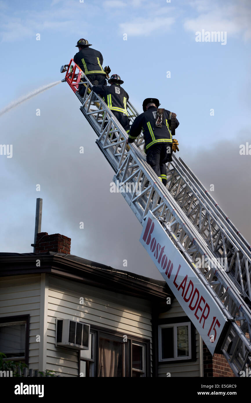 Firefighters respond to a 6-alarm house fire in Boston, Massachusetts USA Stock Photo