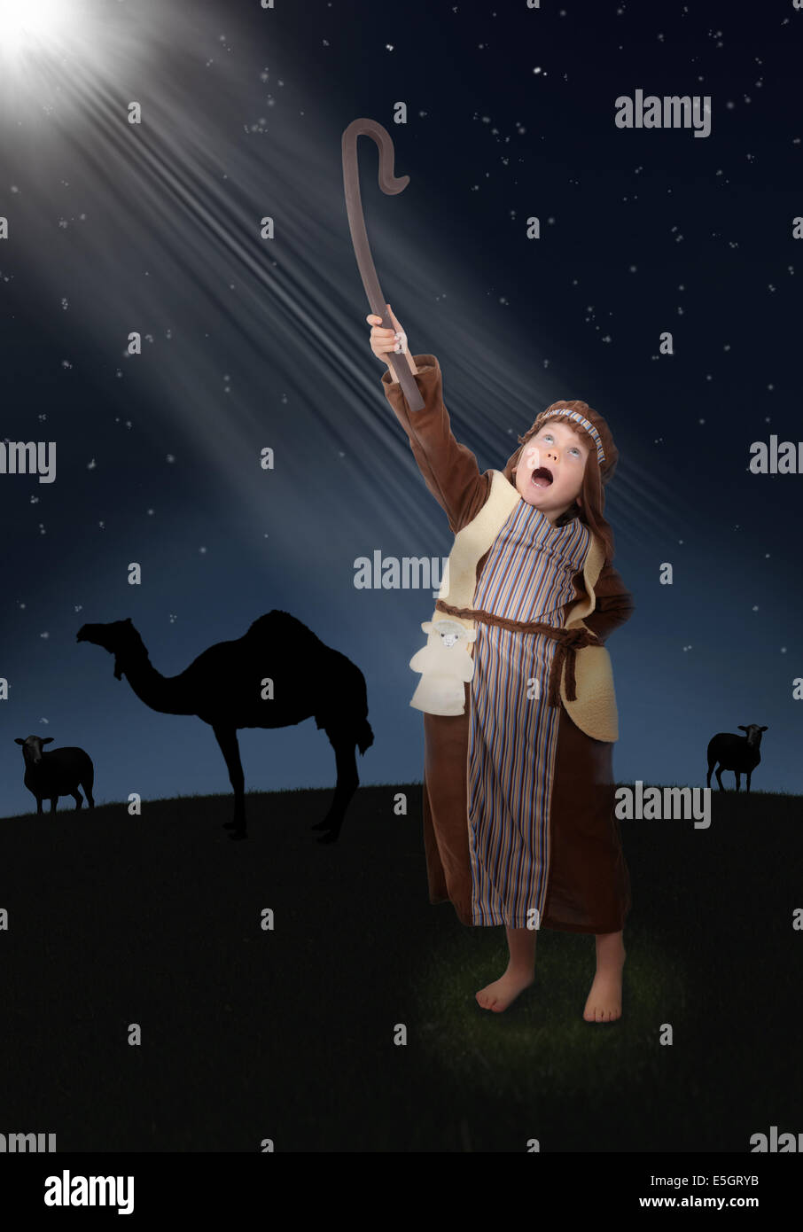 young shepherd seeing the light of the guiding star Stock Photo