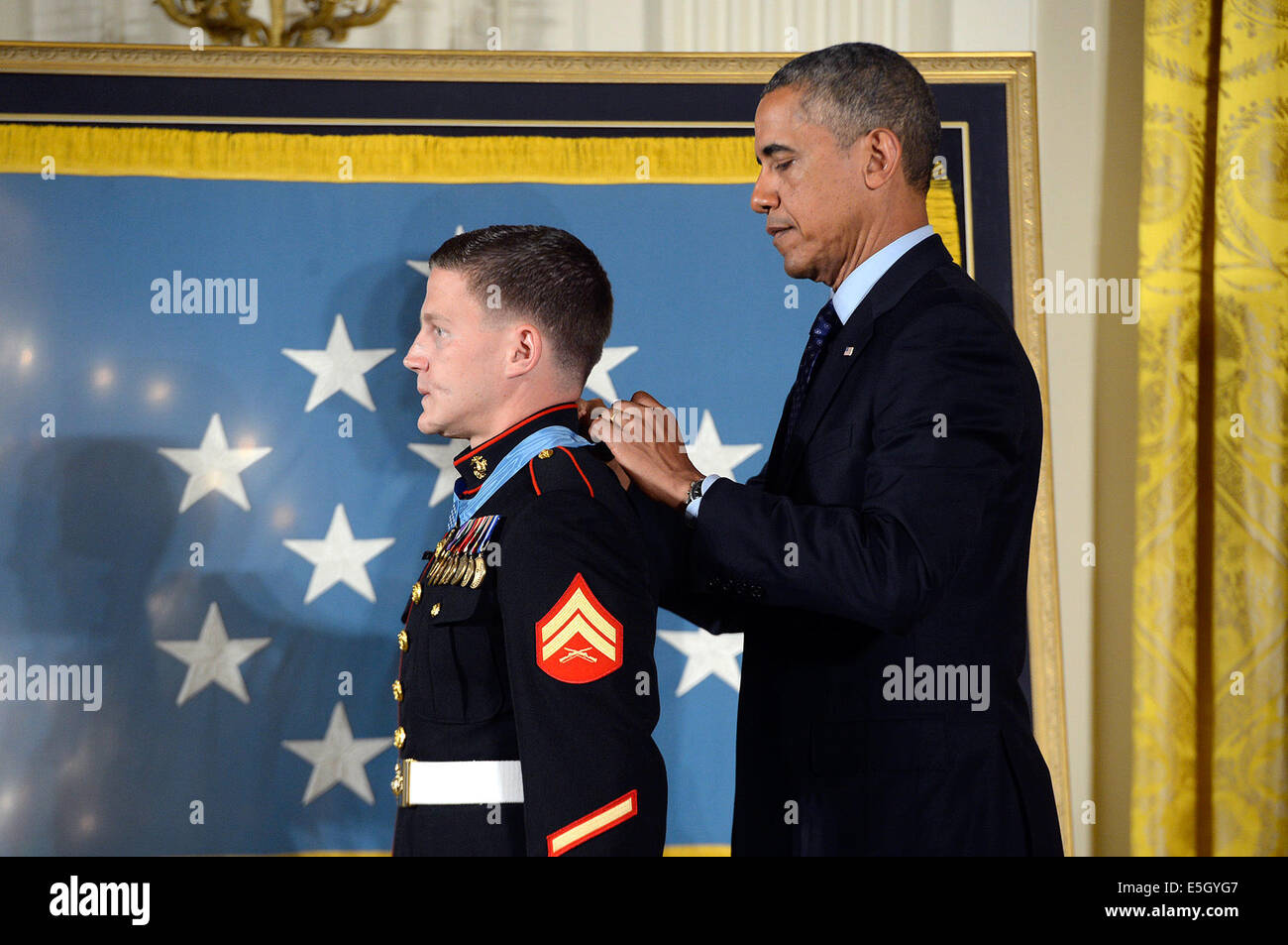 President Barack Obama, right, awards the Medal of Honor to retired U.S ...