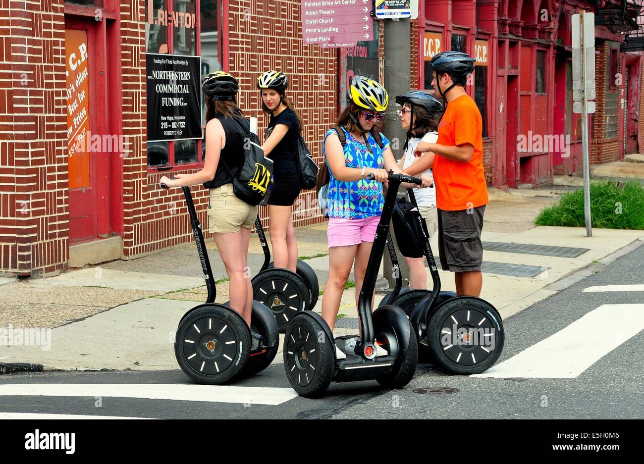 PHILADELPHIA, PA:  A group of tourists practise their skills on two wheeled Segways Stock Photo