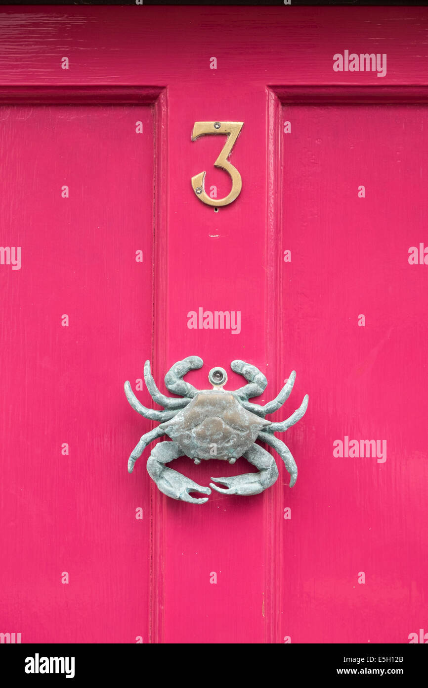 Door knocker in shape of crab on house in small fishing village on Moray coast in Scotland Stock Photo