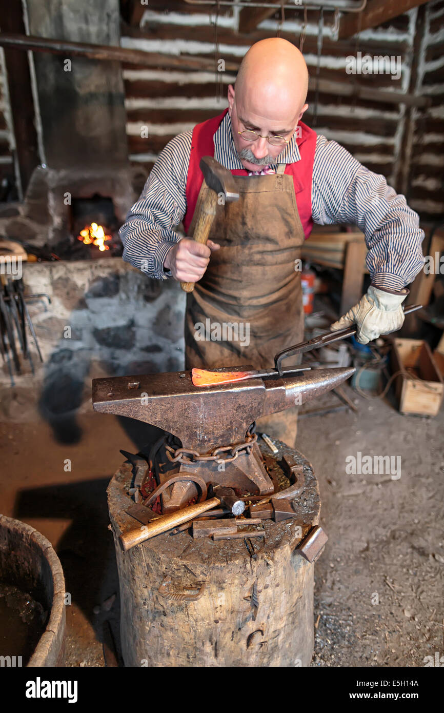 Blacksmith hammering on anvil, Festival du Voyageur, Winnipeg, Manitoba, Canada Stock Photo