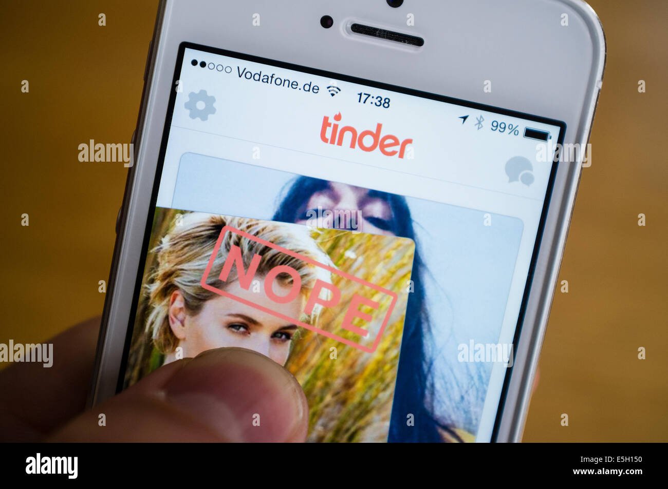 Tinder online dating app on iPhone smart phone Stock Photo