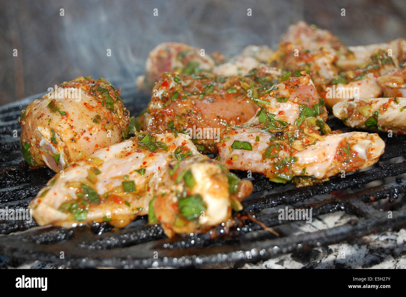 Hot chicken wings and drumsticks on the grill Stock Photo Alamy