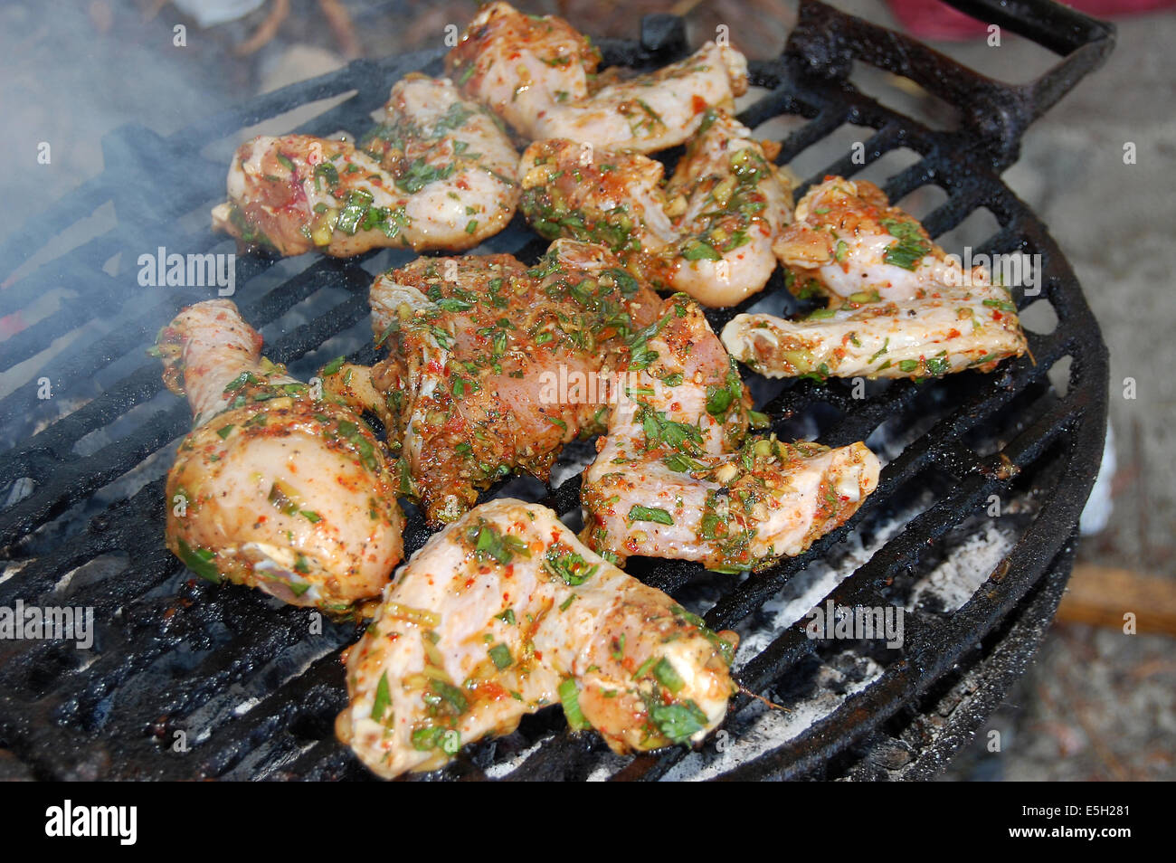 Hot chicken wings and drumsticks on the grill Stock Photo Alamy