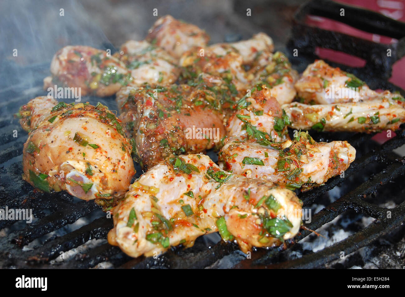 Hot chicken wings and drumsticks on the grill Stock Photo Alamy