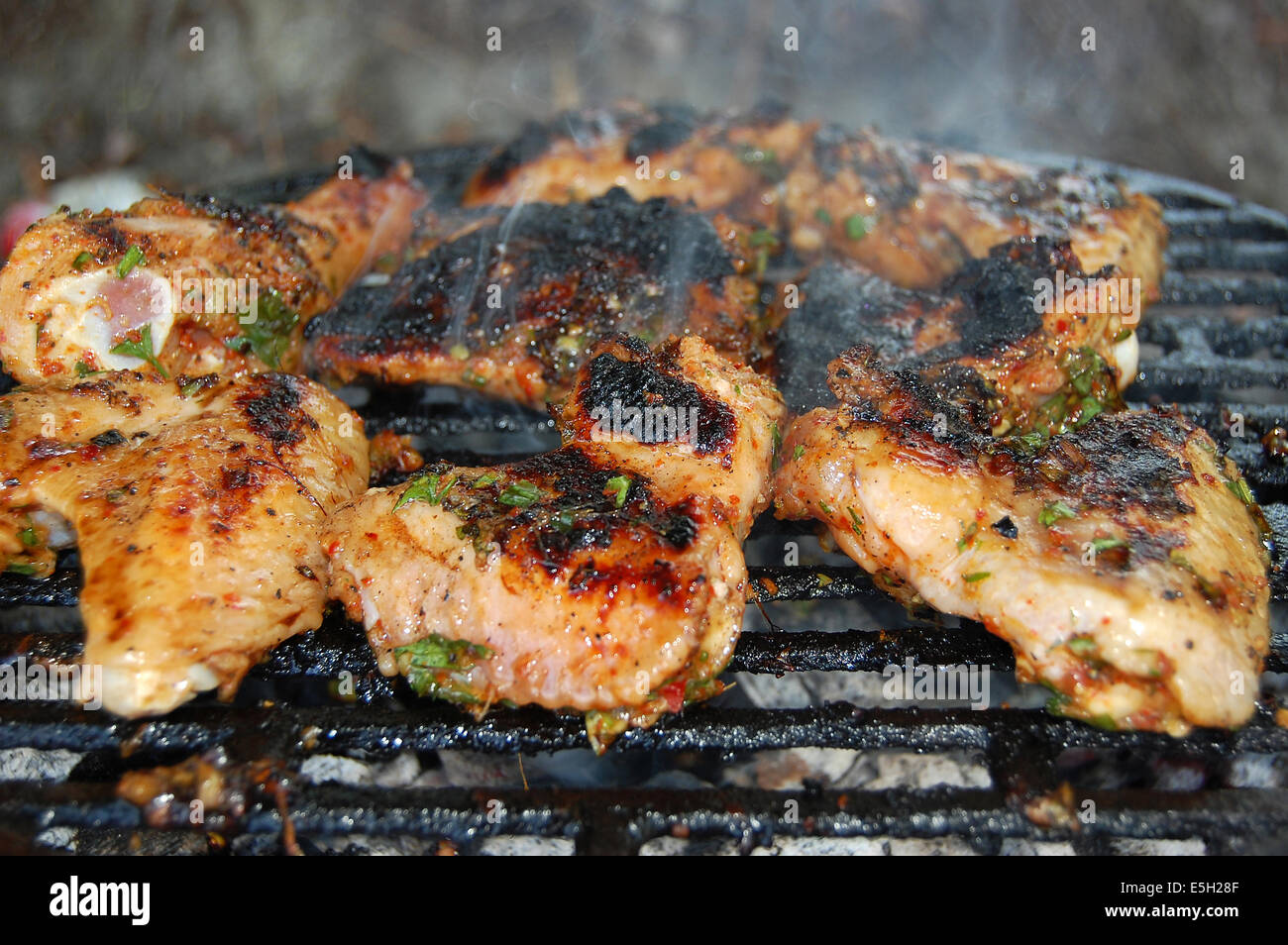 Hot chicken wings and drumsticks on the grill Stock Photo Alamy