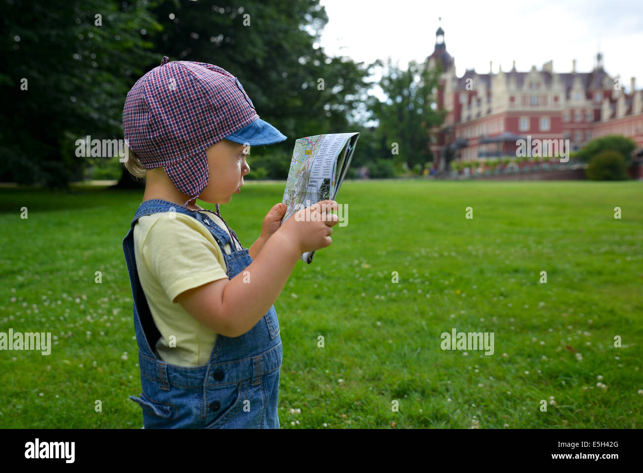 Two years old boy with a map Stock Photo Alamy