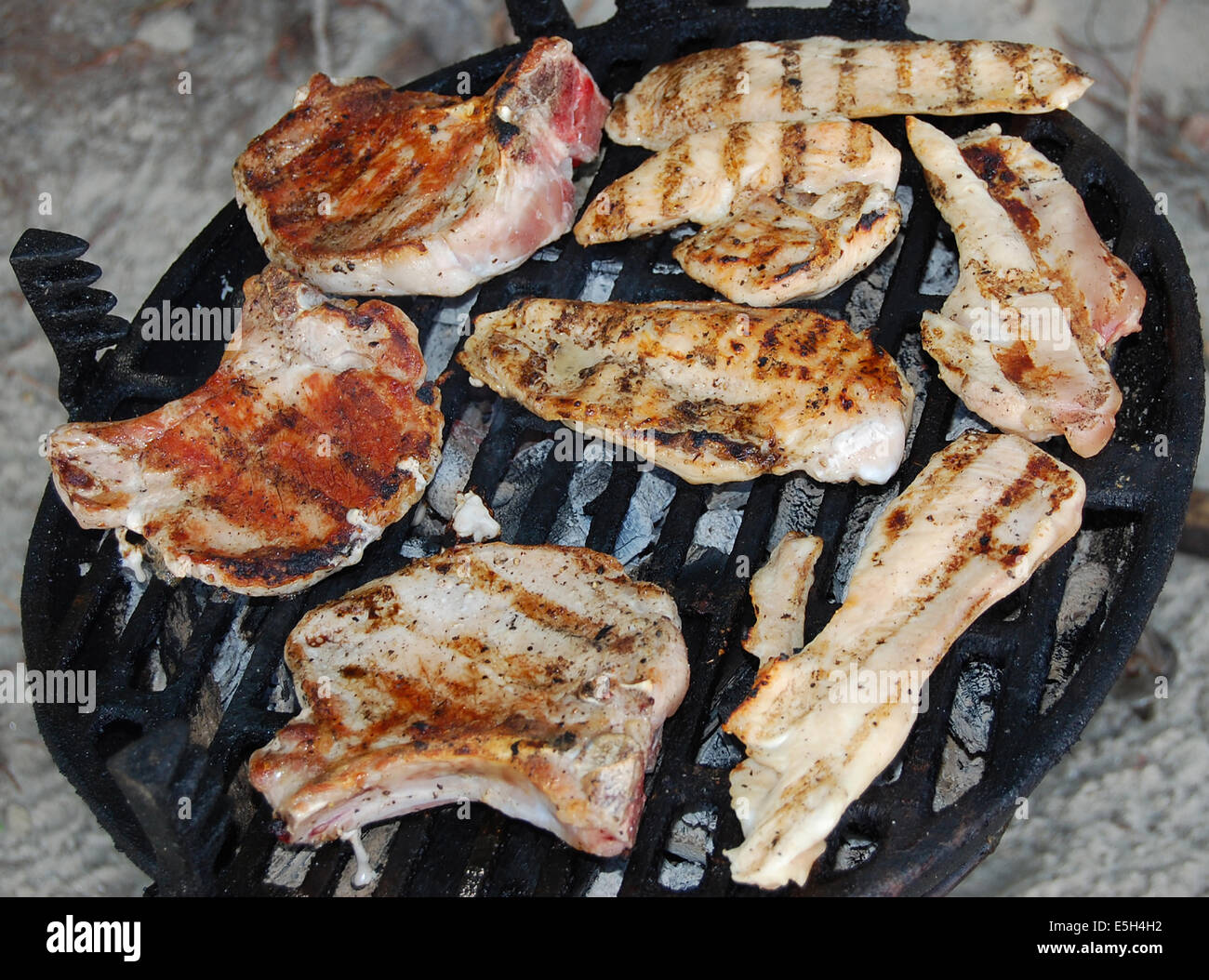 More types of meat roasted on a grill Stock Photo Alamy