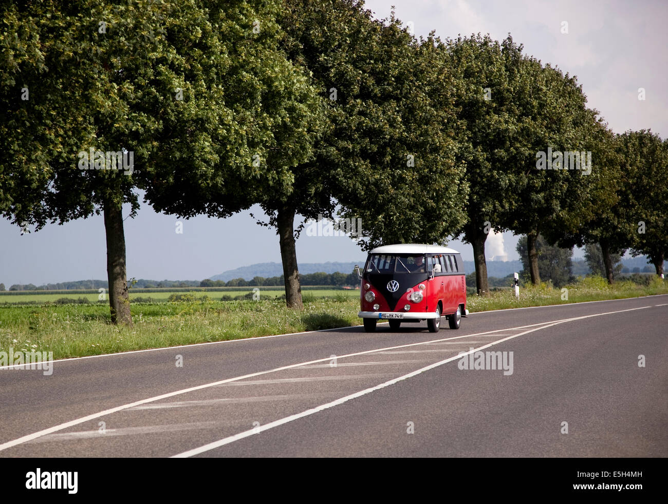 VW Microbus on a road in Germany Stock Photo