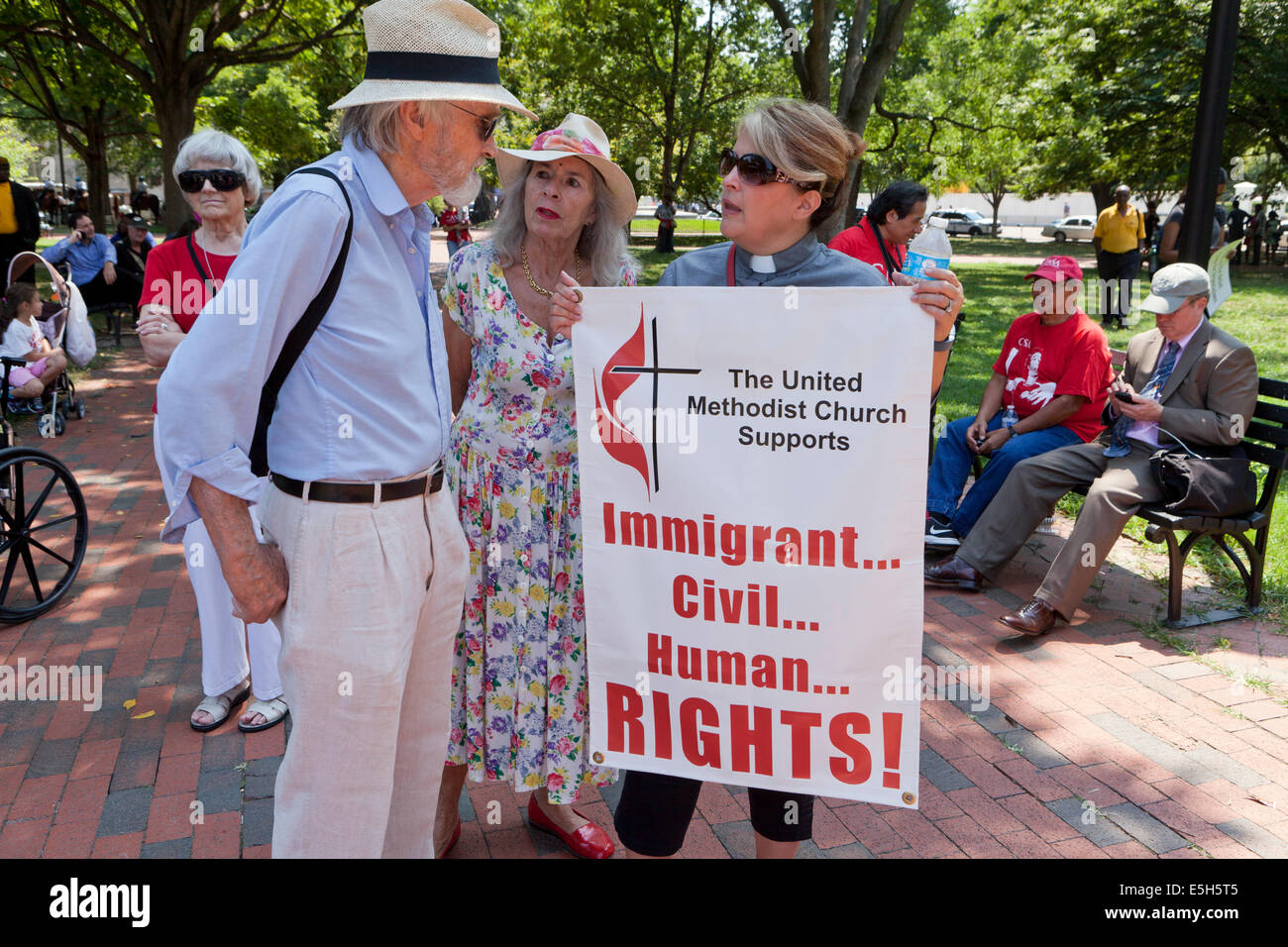 Washington DC, USA. 31st July, 2014.  Amid continual immigration debate in Washington, interfaith leaders and immigration reform activists gather in front of the White House to urge President Obama to stop deportations of immigrant families. Credit:  B Christopher/Alamy Live News Stock Photo