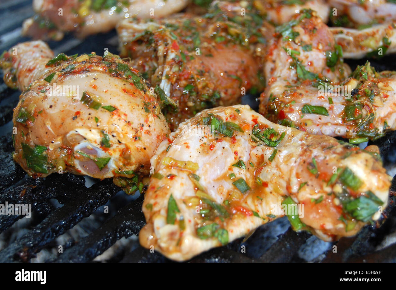 Hot chicken wings and drumsticks on the grill Stock Photo Alamy
